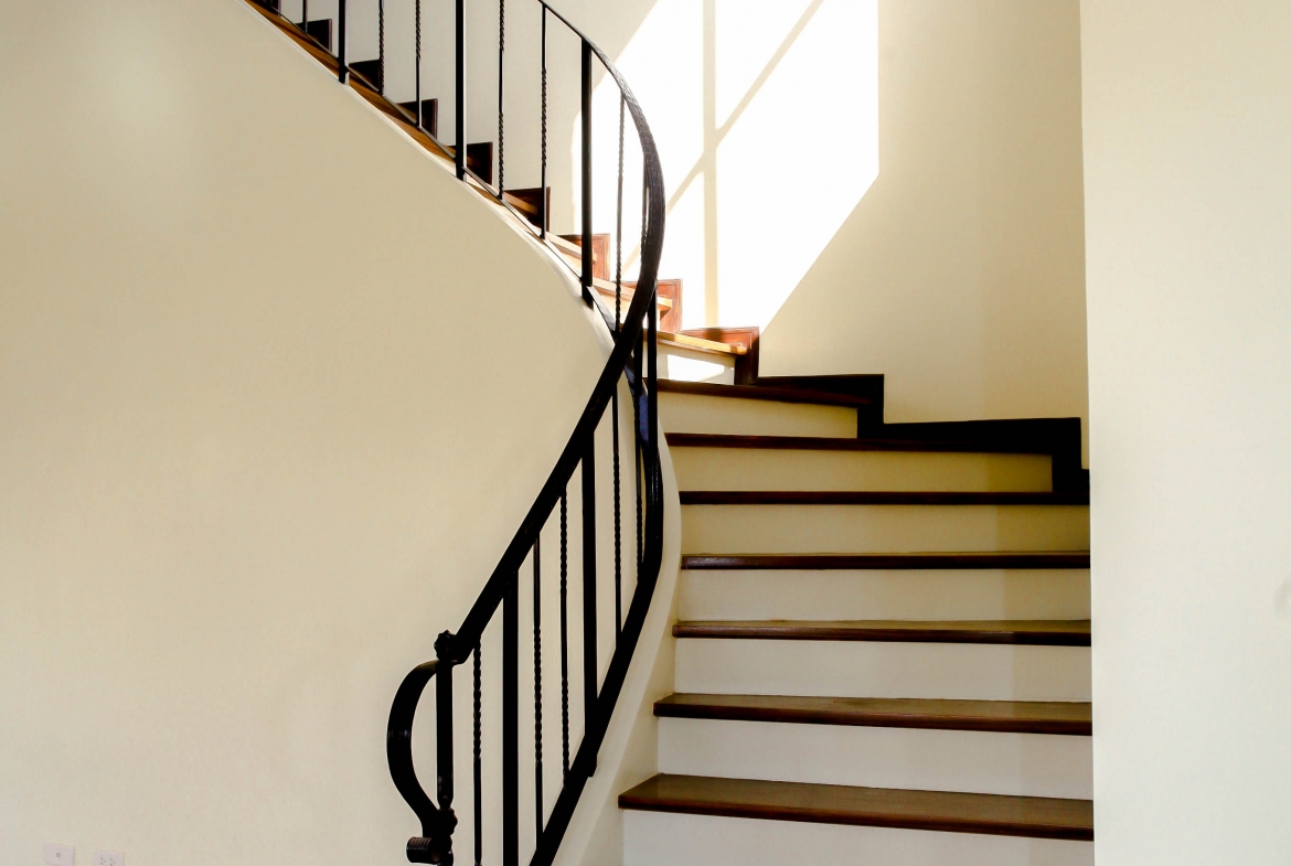 Grandiose staircase within Pietro Luxury Home