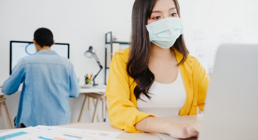 asia-businesswoman-entrepreneur-wearing-medical-face-mask-social-distancing-new-normal-situation-virus-prevention-while-using-laptop-back-work-office-lifestyle-after-corona-virus